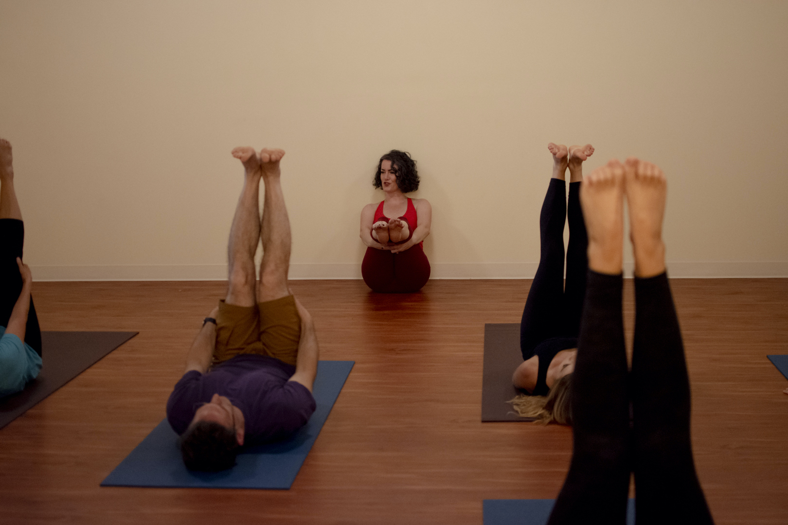 Sage leading an asana class